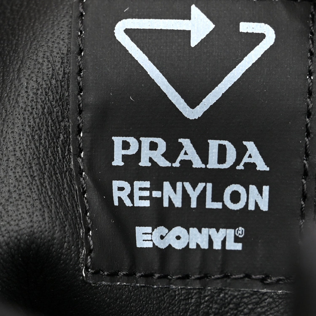 RE-NYLON GABARDINE METAL TRIANGLE LOGO MONOLITH POUCH POCKET 55MM BOOTS BLACK