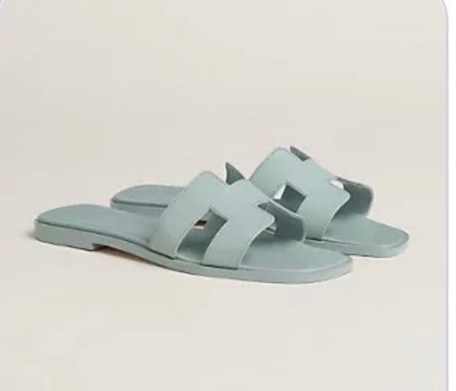 HERMÈS ORAN SANDAL IN VERT D'EAU CALFSKIN